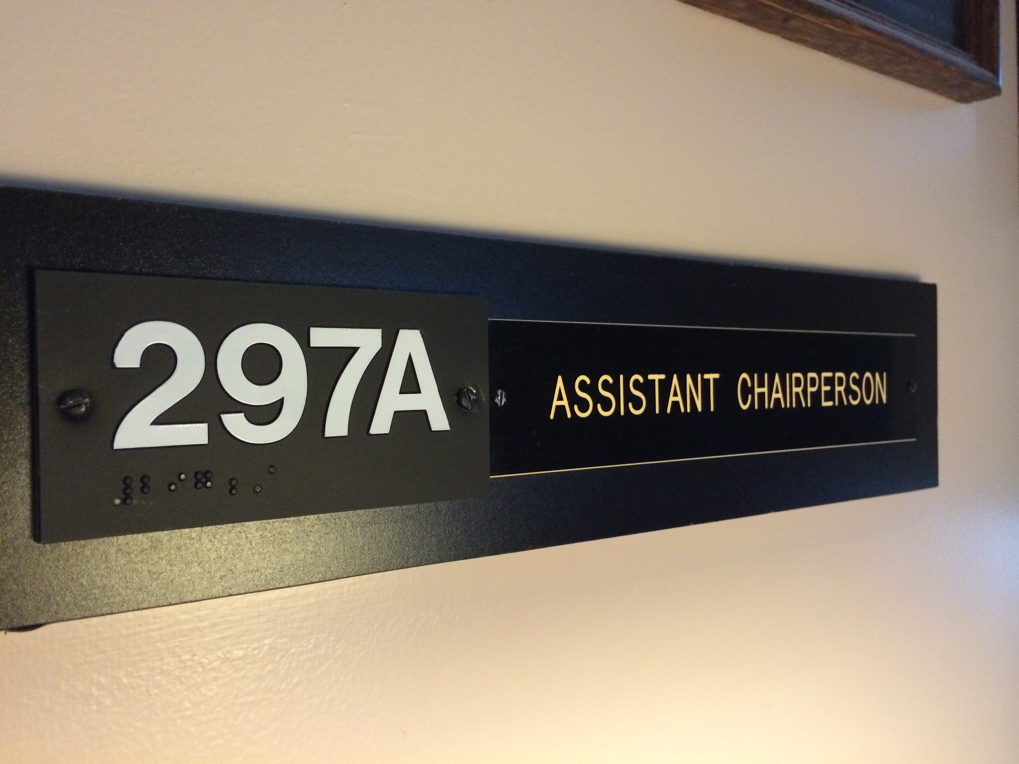 Sign that reads 297A Assistant Chairperson
